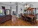 Open-concept dining area with wood floors, views of the backyard, and comfortable seating at 867 Hanover Way, Lakeland, FL 33813