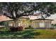 Charming single-story home with well-maintained landscaping and a mature shade tree in a desirable neighborhood at 867 Hanover Way, Lakeland, FL 33813