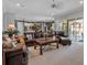Spacious living room with leather furniture and access to the outdoor patio at 867 Hanover Way, Lakeland, FL 33813