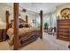 Luxurious main bedroom featuring a four-poster bed and large windows at 867 Hanover Way, Lakeland, FL 33813