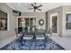 Outdoor patio with dining furniture, a ceiling fan, and view of the yard at 867 Hanover Way, Lakeland, FL 33813