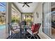 Outdoor patio with seating area, ceiling fan, and access to the pool at 867 Hanover Way, Lakeland, FL 33813