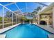 Sparkling pool with screened enclosure, perfect for outdoor enjoyment at 867 Hanover Way, Lakeland, FL 33813