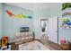 Bedroom with toys, and décor and a door leading to another room at 1112 View Pointe Cir, Lake Wales, FL 33853