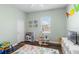 Playroom with wood floors, a window, and plenty of toys and activities for children at 1112 View Pointe Cir, Lake Wales, FL 33853