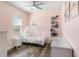 Charming bedroom with a whimsical princess carriage bed and pink walls at 1112 View Pointe Cir, Lake Wales, FL 33853