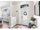 Inviting home foyer featuring hardwood floors, arched doorway, and stylish decor at 1112 View Pointe Cir, Lake Wales, FL 33853