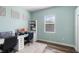 Cozy home office features a modern desk, two monitors, and natural light from a window at 1112 View Pointe Cir, Lake Wales, FL 33853