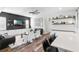 Open-concept living room features a black accent wall, recessed lighting, and modern decor at 1112 View Pointe Cir, Lake Wales, FL 33853