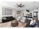 Spacious living room flows into a modern kitchen with bar seating and outdoor views at 1112 View Pointe Cir, Lake Wales, FL 33853
