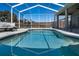 Sparkling pool featuring a safety fence, covered lanai, and comfortable seating at 1112 View Pointe Cir, Lake Wales, FL 33853