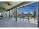 The covered lanai looks out to a fenced pool and a well manicured backyard with mature landscaping at 1112 View Pointe Cir, Lake Wales, FL 33853