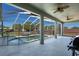 Covered pool with a -safety fence and comfortable seating that overlooks the backyard at 1112 View Pointe Cir, Lake Wales, FL 33853