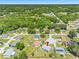 Aerial view of a charming residential area, showcasing houses with green lawns and mature trees at 3548 Galloway Oaks Ct, Lakeland, FL 33810