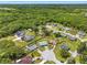 Expansive aerial view of a residential neighborhood featuring lush greenery and well-maintained properties at 3548 Galloway Oaks Ct, Lakeland, FL 33810