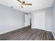 Empty bedroom featuring viny floors, a ceiling fan, and double-door closet at 3548 Galloway Oaks Ct, Lakeland, FL 33810