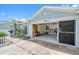 Exterior shot of a garage with an open door, leading to a laundry area with a washer and dryer at 3548 Galloway Oaks Ct, Lakeland, FL 33810