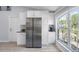 Spacious kitchen with stainless steel refrigerator and a large window with natural light at 3548 Galloway Oaks Ct, Lakeland, FL 33810