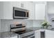 Contemporary kitchen with stainless steel appliances and granite countertops at 3548 Galloway Oaks Ct, Lakeland, FL 33810