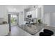 Bright kitchen with stainless steel appliances, gray backsplash, and breakfast bar seating at 3548 Galloway Oaks Ct, Lakeland, FL 33810