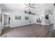 Spacious living room with an open floor plan, vinyl floors, and access to kitchen and bedrooms at 3548 Galloway Oaks Ct, Lakeland, FL 33810