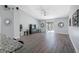 Bright living room features gray wood floors, high ceilings, and sliding glass doors to the outdoor space at 3548 Galloway Oaks Ct, Lakeland, FL 33810