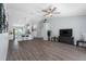 Spacious living room featuring wood floors, recessed lights, and open concept design to the kitchen at 3548 Galloway Oaks Ct, Lakeland, FL 33810