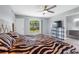 Comfortable main bedroom featuring vinyl floors, a ceiling fan, and a view of the back yard at 3548 Galloway Oaks Ct, Lakeland, FL 33810