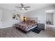 Comfortable main bedroom featuring vinyl floors, a ceiling fan, and ensuite bathroom at 3548 Galloway Oaks Ct, Lakeland, FL 33810