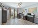 Well-lit home office with light wood floors, ceiling fan, and a view to the outside at 3548 Galloway Oaks Ct, Lakeland, FL 33810