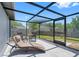 Screened patio featuring a seating area, lounge chair, and view of backyard at 3548 Galloway Oaks Ct, Lakeland, FL 33810