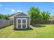 Backyard shed offers extra storage space, complementing the home's outdoor features amid a lush green lawn at 3548 Galloway Oaks Ct, Lakeland, FL 33810