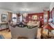 Ornate living room with decorative furniture, a chandelier, and a vibrant accent wall for a luxurious ambiance at 1062 Mayflower Ave, Deltona, FL 32725