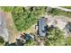 Aerial view of the home showing the full roof, deck, and tree coverage at 4609 Creek Meadow Trl, Lakeland, FL 33810