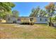 A manufactured home featuring a wooden deck and well-maintained backyard at 4609 Creek Meadow Trl, Lakeland, FL 33810