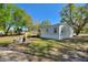 Backyard featuring a small wooden deck and tree coverage at 4609 Creek Meadow Trl, Lakeland, FL 33810