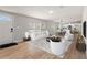 Bright, open-concept living room featuring hardwood floors and large windows for natural light at 4609 Creek Meadow Trl, Lakeland, FL 33810