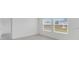 Bright bedroom with large windows and neutral walls offers a peaceful retreat at 140 Jones Fish Camp Rd, Edgewater, FL 32141