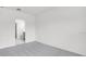 Bedroom with bathroom access and neutral gray carpet at 140 Jones Fish Camp Rd, Edgewater, FL 32141