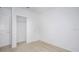 Neutral bedroom featuring carpet, a closet and white walls at 140 Jones Fish Camp Rd, Edgewater, FL 32141