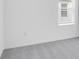Bedroom features neutral gray carpet and a window at 140 Jones Fish Camp Rd, Edgewater, FL 32141