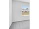 Bedroom features neutral gray carpet and a window at 140 Jones Fish Camp Rd, Edgewater, FL 32141