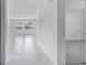 Bright hallway with view to large living area and windows at 140 Jones Fish Camp Rd, Edgewater, FL 32141