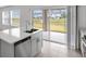 Bright kitchen with stainless steel dishwasher, double sink, and an outdoor view at 140 Jones Fish Camp Rd, Edgewater, FL 32141