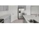 Gleaming stainless steel refrigerator and gray cabinets complement the modern kitchen design at 140 Jones Fish Camp Rd, Edgewater, FL 32141
