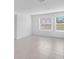 Spacious living room bathed in natural light showcases tile flooring and neutral walls at 140 Jones Fish Camp Rd, Edgewater, FL 32141