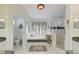 Relaxing bathroom with a soaking tub, separate shower, and dual sink vanity at 10837 Versailles Blvd, Clermont, FL 34711