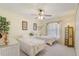 Bright bedroom with two twin beds, ceiling fan, and nice decorations at 10837 Versailles Blvd, Clermont, FL 34711