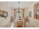 Bright dining room features a chandelier and seating for six, great for Gathering meals at 10837 Versailles Blvd, Clermont, FL 34711