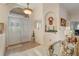 Bright foyer boasts double doors, tile flooring, and an arched transom window at 10837 Versailles Blvd, Clermont, FL 34711